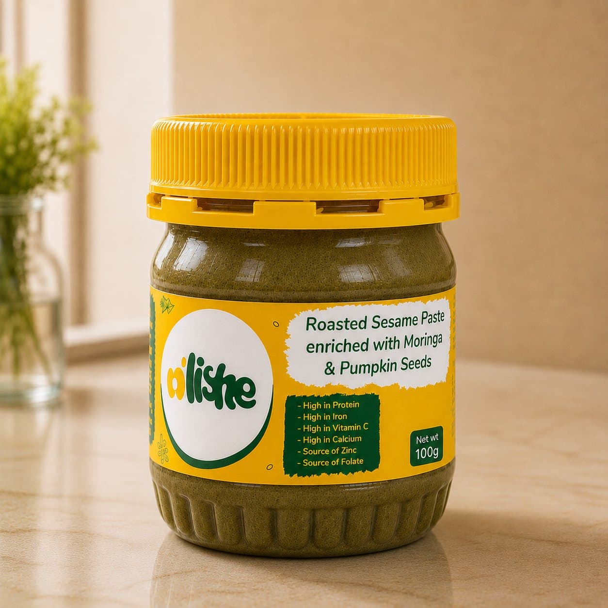 A jar of N'Lishe roasted sesame paste on a kitchen counter.